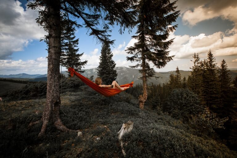 | Chill & Thrive a women in a hammock enjoying Mountain View