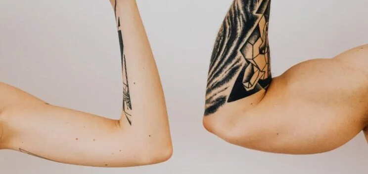 | Chill & Thrive A Woman and a Man Holding Dumbbells