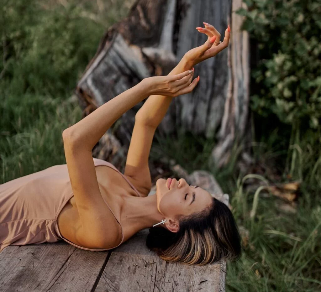 | Chill & Thrive Sensual elegant woman with closed eyes on wooden table