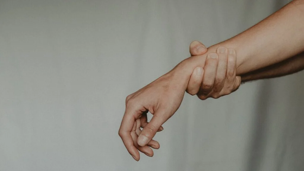 | Chill & Thrive Unrecognizable person holding hand of partner abusively