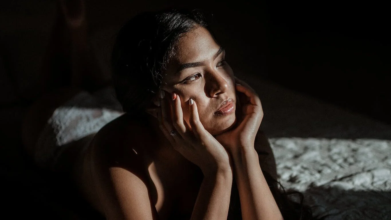 | Chill & Thrive Woman Lying on Bed and thinking