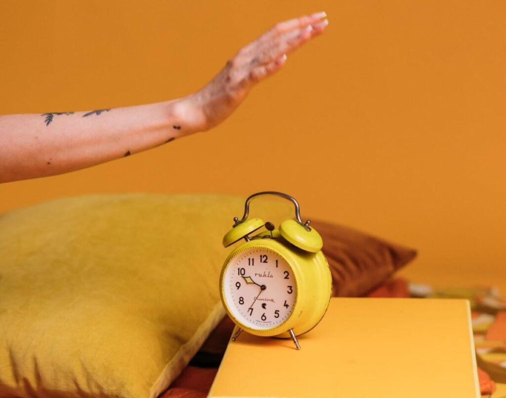 Photo by KoolShooters | Chill & Thrive Yellow Alarm Clock On A Yellow Box
