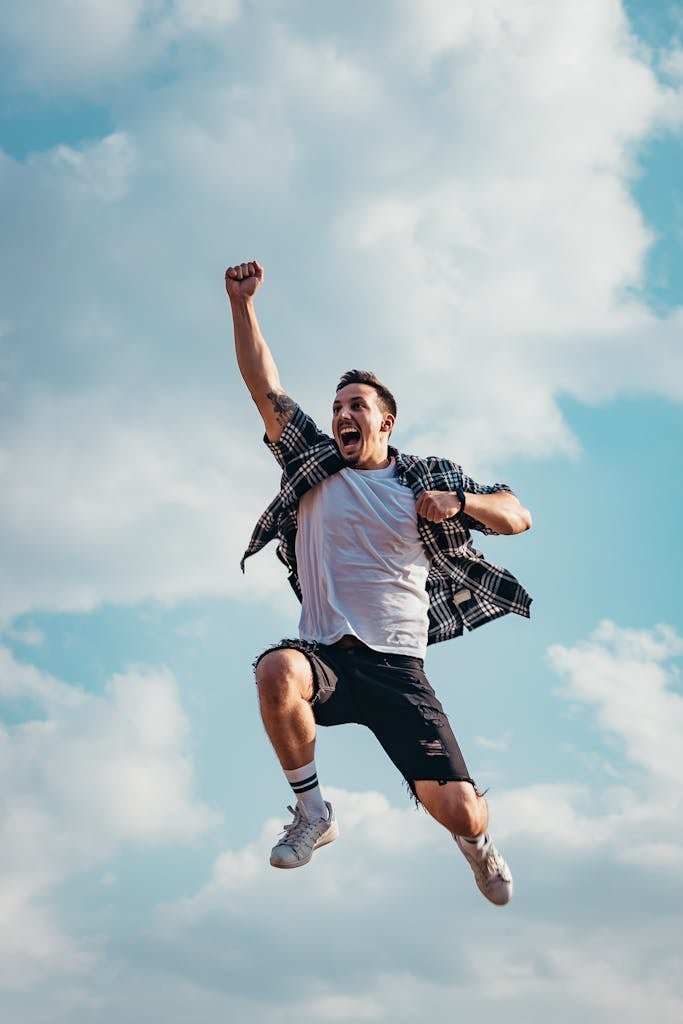 | Chill & Thrive Low Angle Photography of Man Jumping