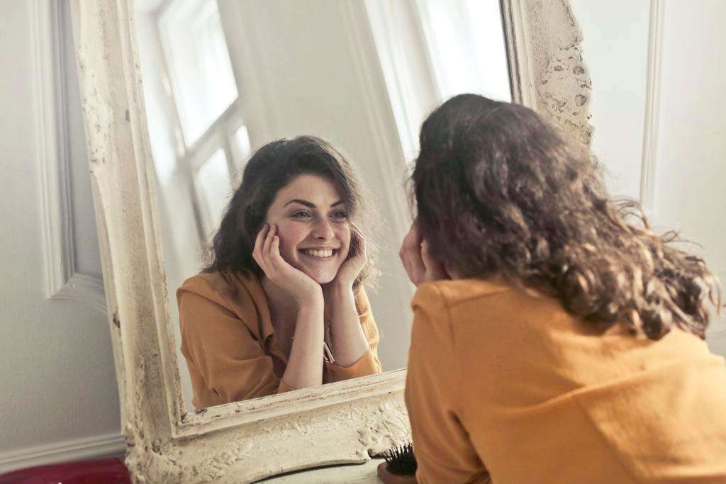 | Chill & Thrive Photo of Woman Looking at the Mirror with positive affirmations