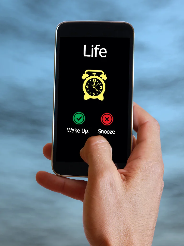 Life alarm on celular phone Wake up or snooze Self awareness concept | Chill & Thrive | Chill & Thrive Life alarm on celular phone Wake up or snooze Self awareness concept